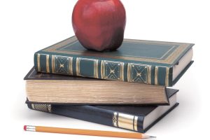 school books and an apple